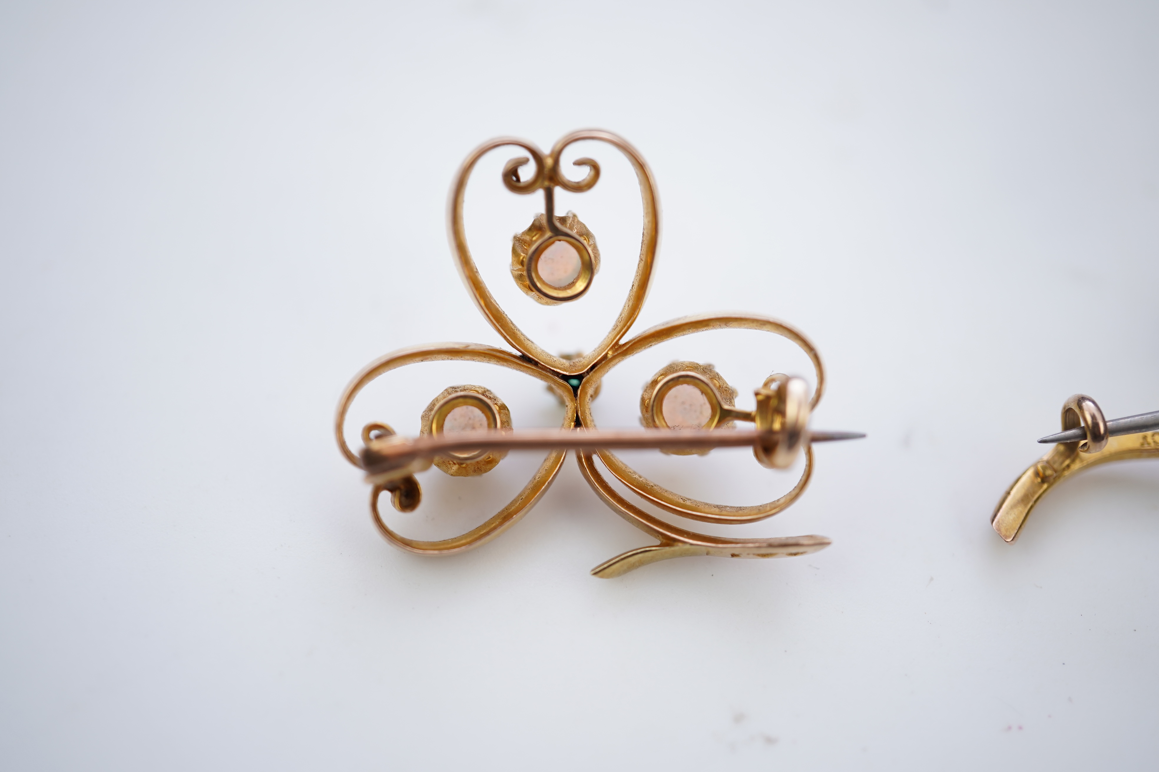 Two gem-set brooches